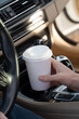 © BM Creative Works - Coffee cup in a car dashboard.