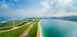 © AmazingAerialAgency - Panoramic aerial view of wind turbine and artificial lake, Mount Gilboa, Israel.