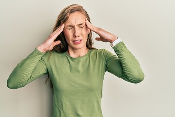 Canvas Print - Young blonde woman wearing casual clothes with hand on head, headache because stress. suffering migraine.