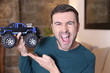© ajr_images - Man holding cool monster truck model
