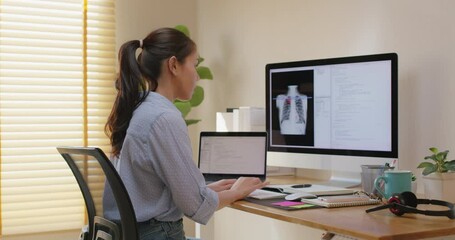 Clinical coder programmer improve future patient care service. Medtech big data tool developer automatic IT software lung X-ray covid analyze cloud computing typing python check code at home office.