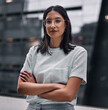© Siphosethu Fanti/peopleimages.com - Determined to make it no matter the cost. Shot of an attractive young businesswoman standing alone in the office with her arms folded during a late shift.