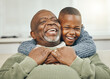 © Siphosethu Fanti/peopleimages.com - My boy, from my boy. Shot of a grandfather bonding with his young grandson on a sofa at home.
