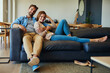 © Camerene P/peopleimages.com - Chilling out with my number one. Full length portrait of an affectionate young couple relaxing on the sofa at home.