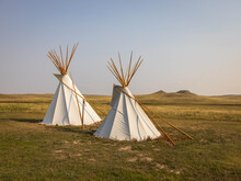 Close-up Shot Of Beautiful Two Teepees Under The Sky