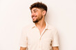 © Asier - Young hispanic man isolated on white background relaxed and happy laughing, neck stretched showing teeth.