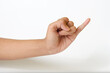 Adult female hand showing pinky little finger or gesture of making a promise on a white background