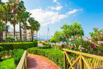 Beautiful promenade with green trees in Kemer, Turkey. Summer landscape, travel and vacation