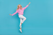 © deagreez - Full length body size view of attractive cheerful wavy-haired girl dancing jumping isolated over bright blue color background