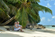 © aletia2011 - Portrait of elderly couple resting on beach. Travel