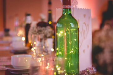 Wall Mural - Closeup shot of decorations on a table with fairy lights