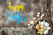 Congratulatory easter background. Easter eggs and flowers. Selective focus. Top view.