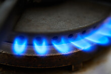 Closeup Of Gas Stove. Blue Flames From Natural Gas Fire