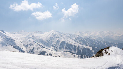 snow-white mountain peaks on a sunny day