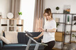 © Sofiia Shunkina - Tone your body. Perfect shape. Improving endurance. Portrait of young sportive woman doing cardio at home and looking at the fitness bracelet. Concept of sport, health, action, nutrition