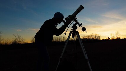 Wall Mural - silhouette of a man, telescope, stars, planets and shooting star under the night sky.
