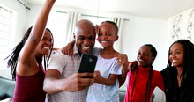 Happy Black Family Receiving Good News In Celebration