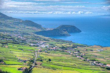 Wall Mural - Morro Grande viewed behind Velas town at Sao Jorge, Azores, portugal