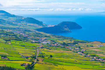 Wall Mural - Morro Grande viewed behind Velas town at Sao Jorge, Azores, portugal