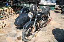An Old Motorcycle With A Classic Sidecar