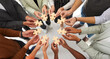 © Studio Romantic - Multiethnic group of young people joining pieces of jigsaw puzzle as metaphor for business team and teamwork. Banner background, cropped high angle top view shot of human hands holding jigsaw parts