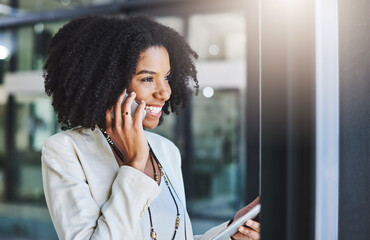Aufkleber - Everything is ready and waiting for your approval. Shot of a young businesswoman making a phone call in her office.