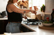 © Chanelle M/peopleimages.com - Stirring prevents sticking. Cropped shot of a woman preparing a meal at home.