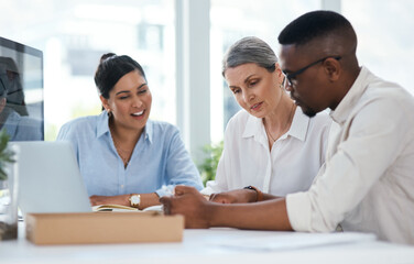 Wall Mural - Understanding new business objectives as a team. Shot of a group of businesspeople working together in an office.