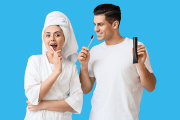 Sticker - Young couple brushing teeth with activated charcoal tooth paste on blue background