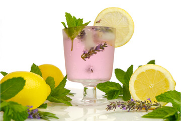 Lavender cocktail in a cocktail glass.Summer drinks. Lavender lemon drink.Purple cocktail,ice , lemons and lavender flowers. Refreshing summer cocktail