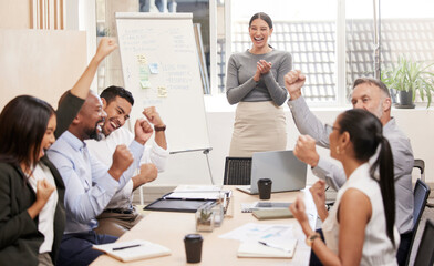 Celebrating their own achievements. Cropped shot of an attractive young businesswoman giving a presentation during a meeting in the boardroom.