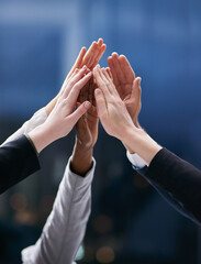 Poster - One team working towards one dream. Shot of a group of colleagues giving each other a high five in an office.