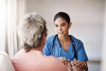 Poster - Im here for you...always. Cropped shot of an attractive young nurse holding a senior womans hands in comfort.