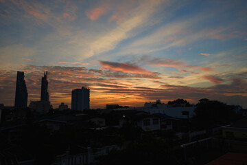 Wall Mural - landscape fantastic sunset or sunrise with rays of light through the sky. beautiful white clouds and