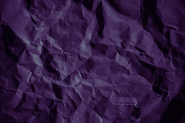 Wall Mural - Purple crumpled paper texture in low light background