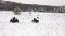 Atv-riders Drive Through The Snowy Field, Aerial Shot