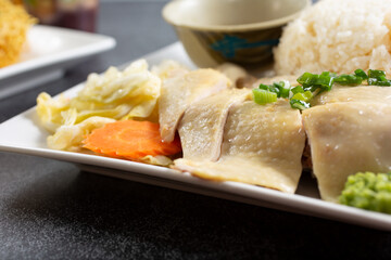 A view of a plate of Hainanese chicken rice.