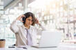 © Pichsakul - Business concept, Businessman talking with colleague by headset and microphone on video conference