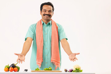 Wall Mural - Cook servant gesturing with arms in front of camera in kitchen