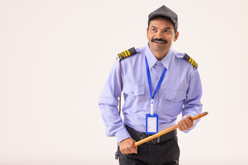 Wall Mural - Security guard monitoring with a stick in his hand