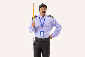 Wall Mural - Portrait of Security guard standing with stick in his hand