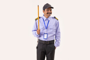 Wall Mural - Portrait of Security guard standing with stick in his hand