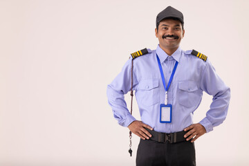 Wall Mural - Portrait of Security guard standing with hands on waist