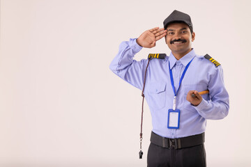 Wall Mural - Portrait of a male security guard saluting