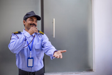 Wall Mural - Portrait of security guard gesturing with his palm