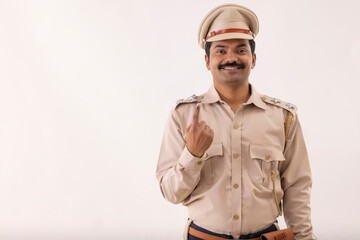 Wall Mural - Portrait of policeman standing with voter mark on index