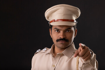 Wall Mural - Close-up portrait of an angry Indian policeman
