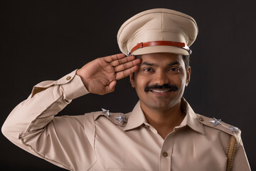 Wall Mural - Close-up portrait of an Indian policeman saluting