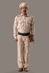 Wall Mural - Portrait of an Indian policeman standing