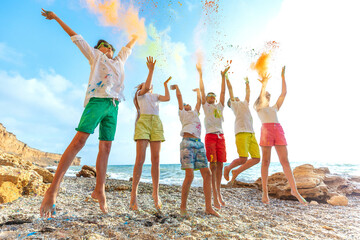 Children play by the sea. A group of children have fun in nature. High quality photo